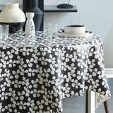 Poppy Graphite – Lola vaxduk med grafisk blommönster, hörn