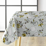 Närbild av Altea Metallic Yellow vaxduk med gyllene julstjärnor