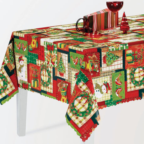 Julvaxduk med patchwork av julpynt i färg på bord