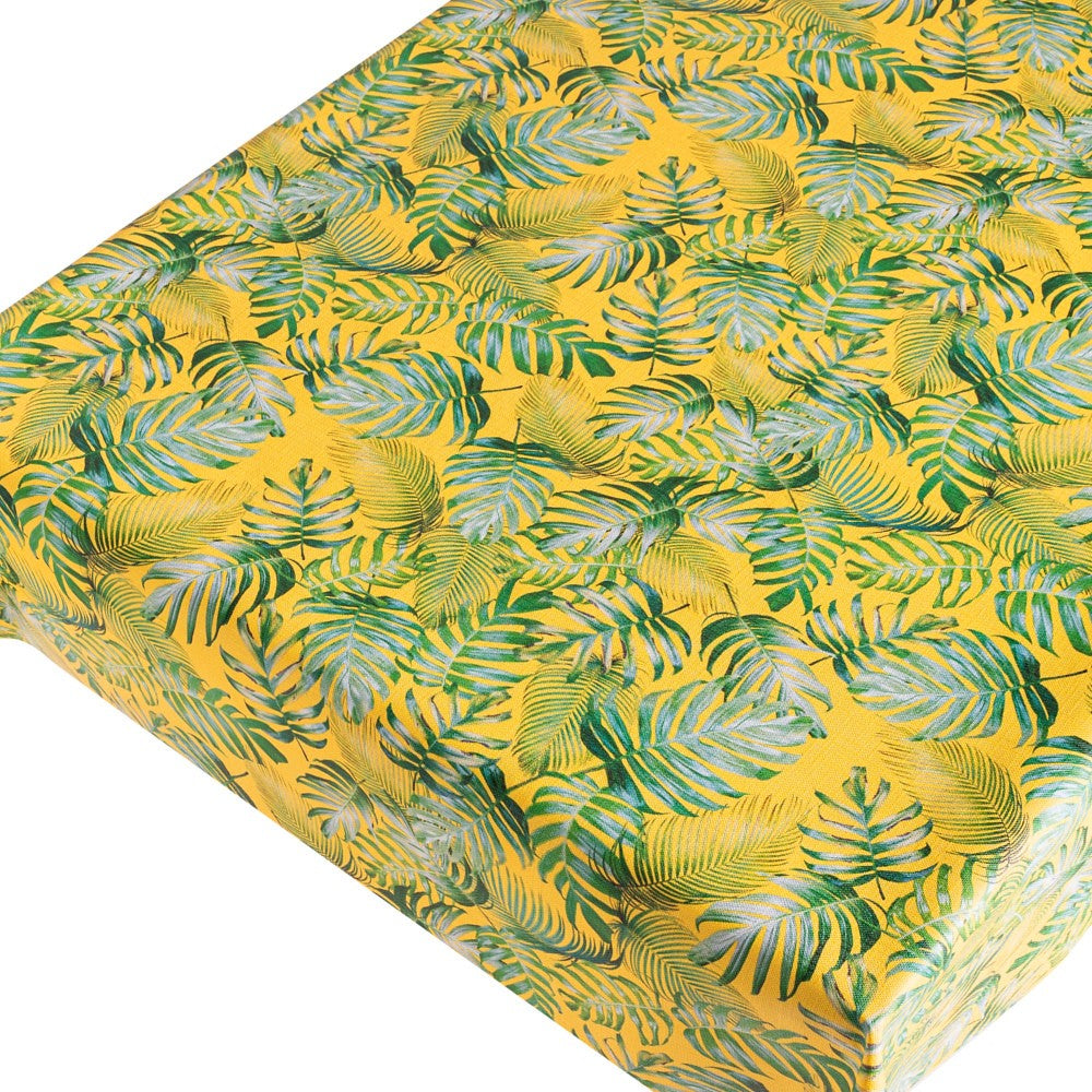 Madeira Yellow - vaxduk med struktur och palmblad på en gul bakgrund