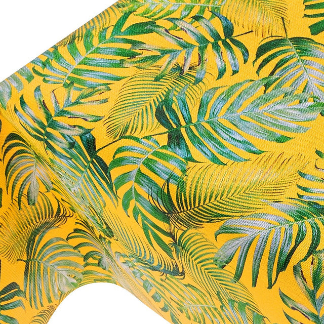 Madeira Yellow - vaxduk med struktur och palmblad på en gul bakgrund närbild