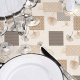 På dukat bord Textilia Glitter Rialto - Vaxduk med blad och art deco-inspirerade rutor